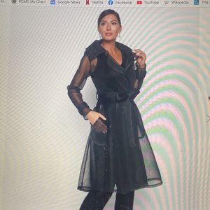 Chic mesh knit coat style jacket with pockets.